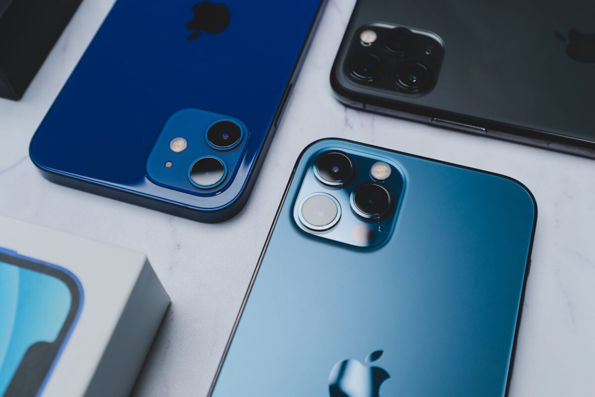 Blue iPhones laying on a table